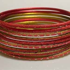 Gorgeous assorted red and gold bracelets. An accent with any holiday outfit.